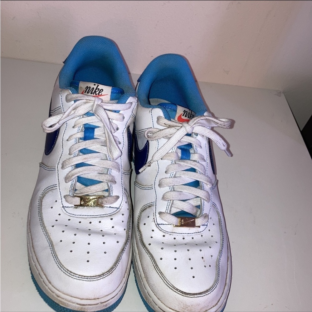 Nike White Sneakers with Blue Accents